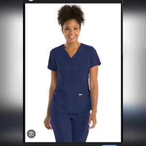 Grey's Anatomy Women's Pocket Modern Fit Mock Wrap Scrub Top Blue Size Small